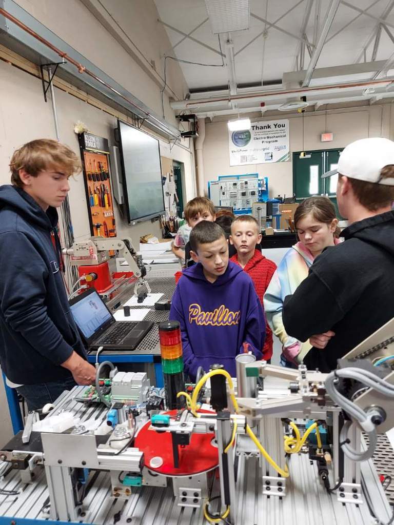 Students watching a demo on a STEM field trip