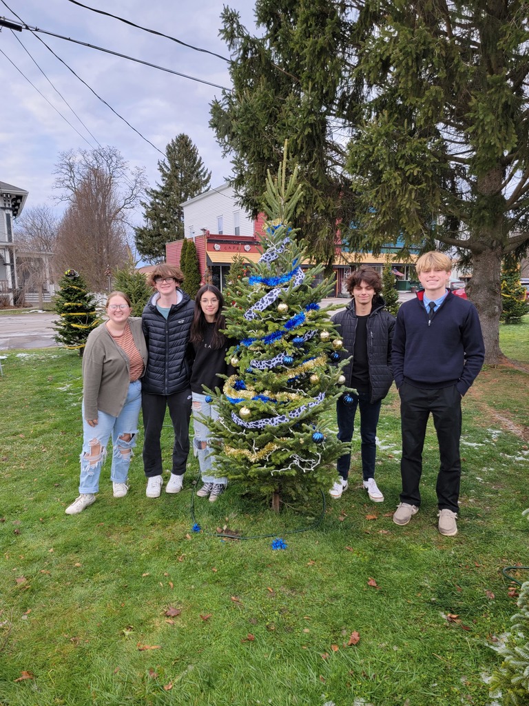 student counsel members with decorated tree