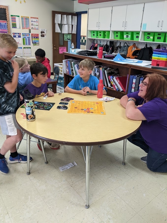 students thinking of strategy while playing Xing math game