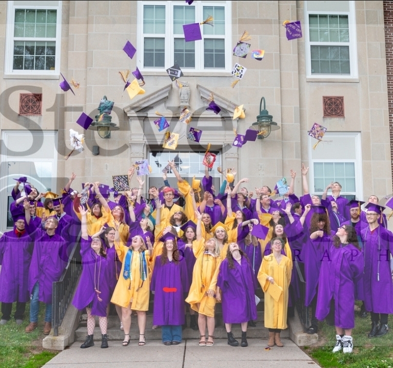caps in the air after graduation